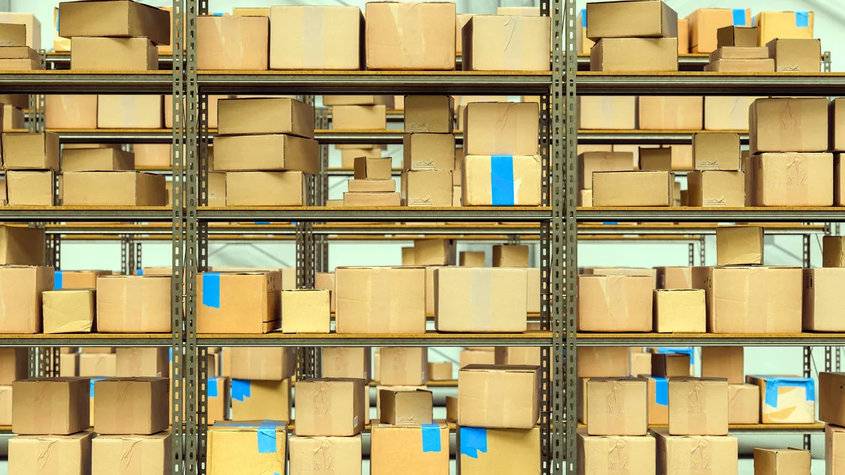 Cardboard boxes stacked on shelves in a record warehouse.